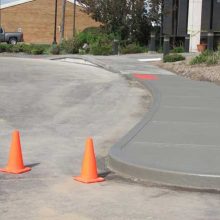 Commercial concrete sidewalk and hand formed curb